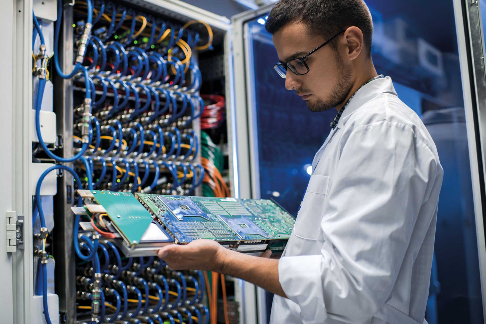 scientist-holding-blade-server-2023-11-27-04-54-17-utc